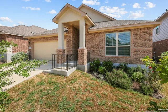 a front view of a house with garden