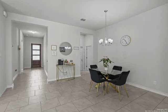 a view of a dining room and kitchen