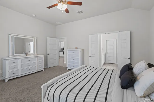 a bedroom with a bed and closet