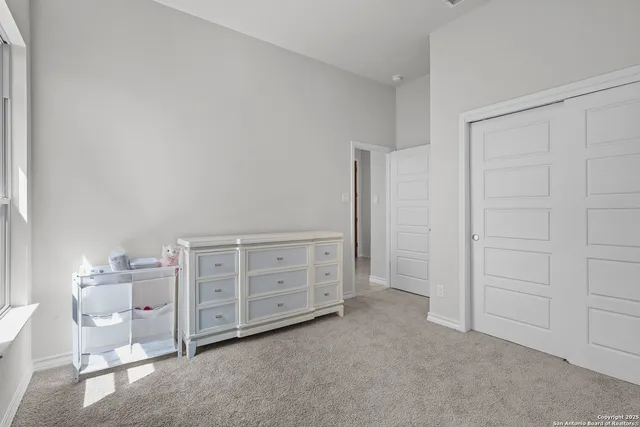 a view of a bedroom with cabinet cabinet and stairs