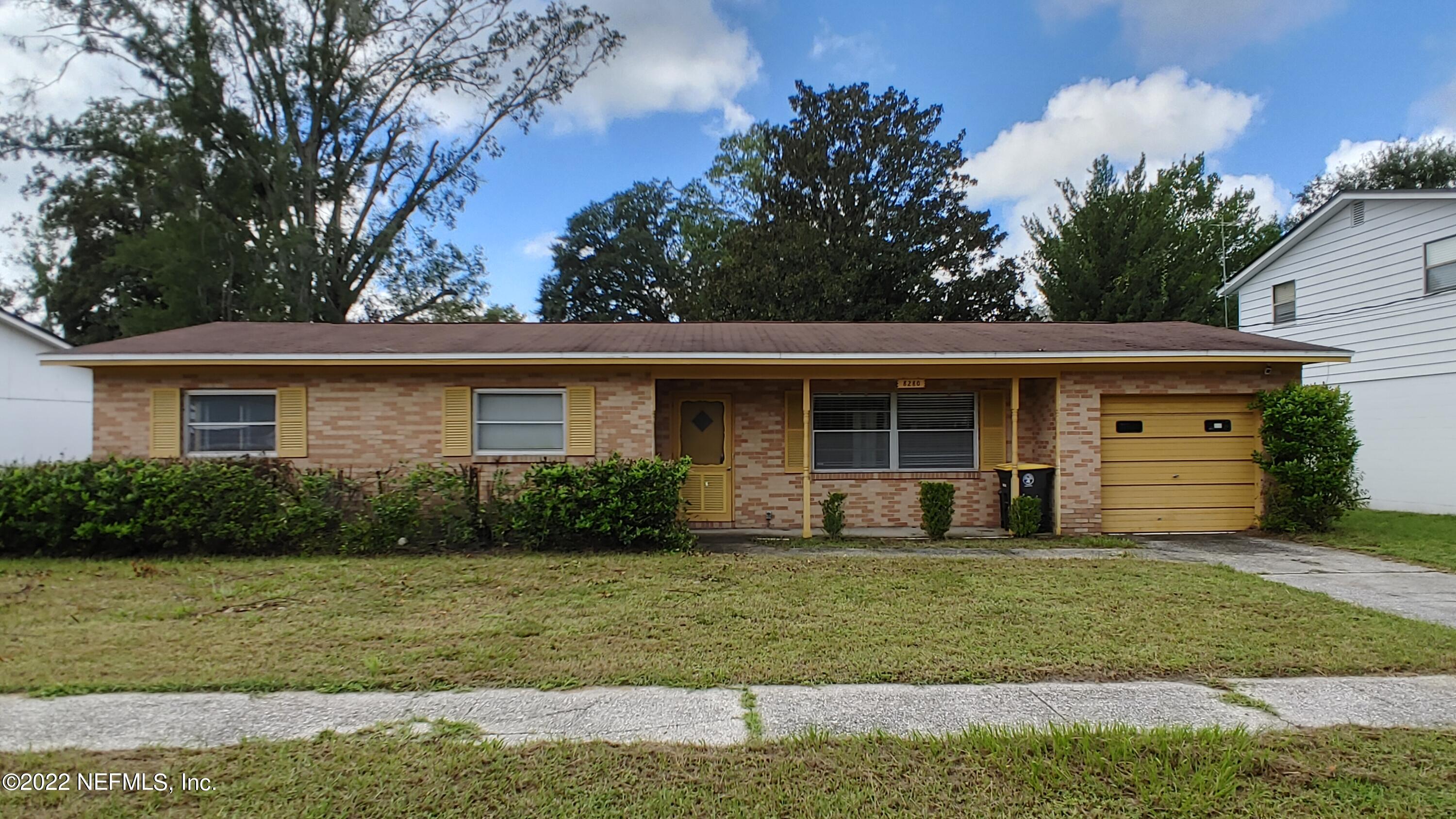 8280 Barracuda Road Jacksonville, FL 32244 - Photo 1 of 13 a front view of a house with a yard