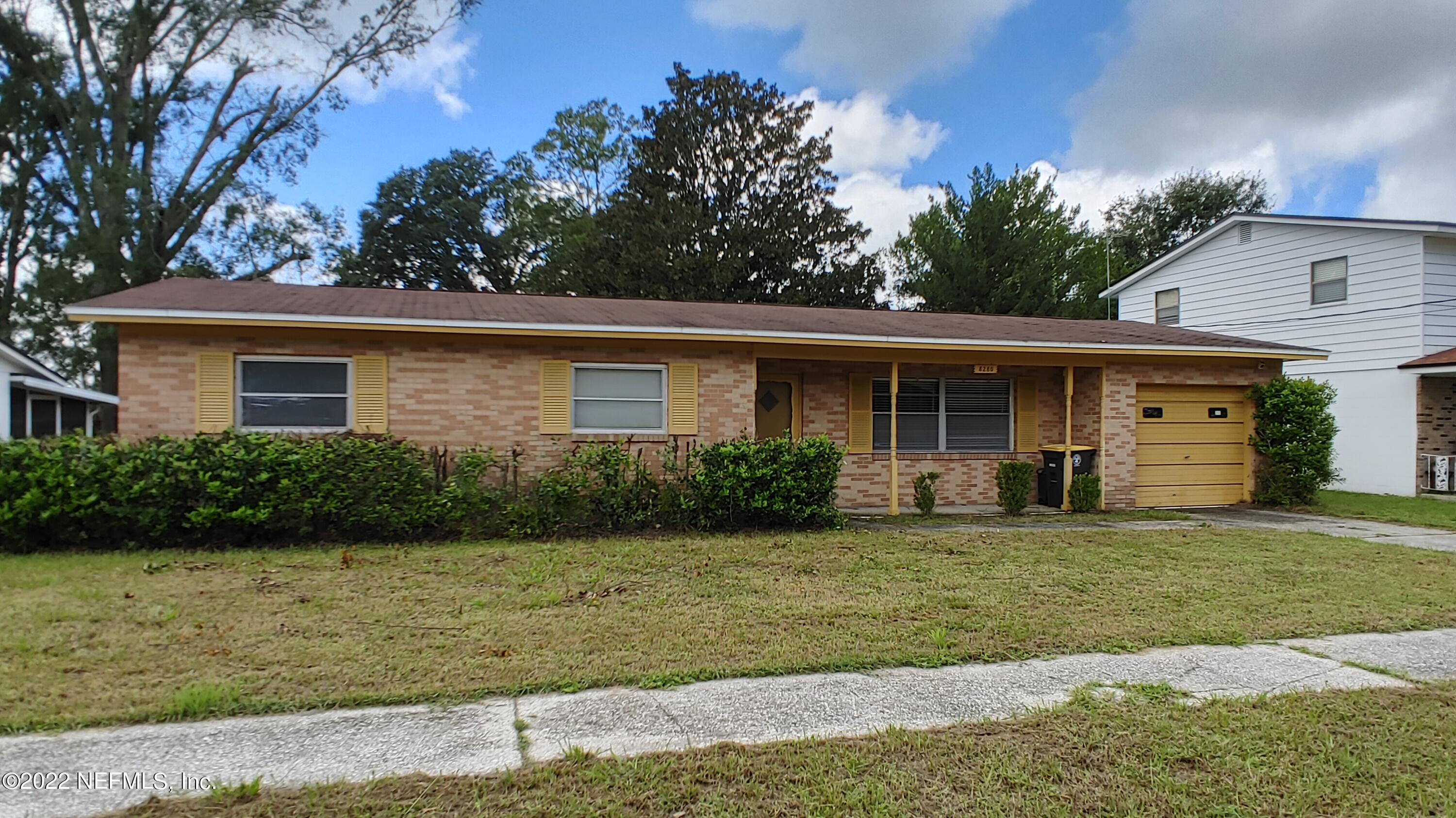 8280 Barracuda Road Jacksonville, FL 32244 - Photo 2 of 13 a front view of a house with a garden