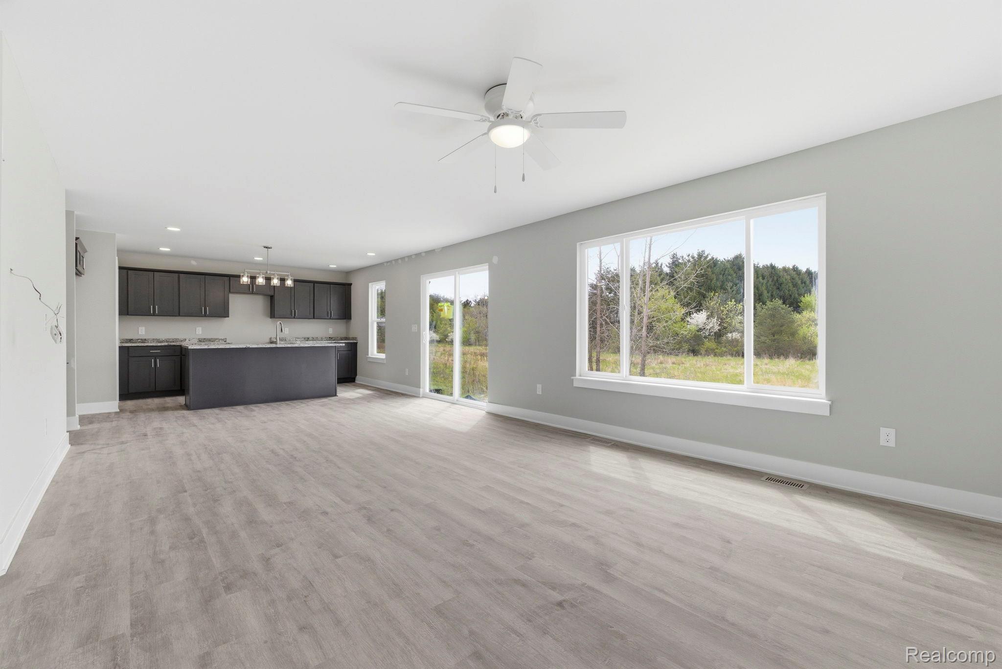 2361 Baltimore Davison, MI 48423 - Photo 7 of 31 Unfurnished living room with light wood-style floors, a ceiling fan, and recessed lighting