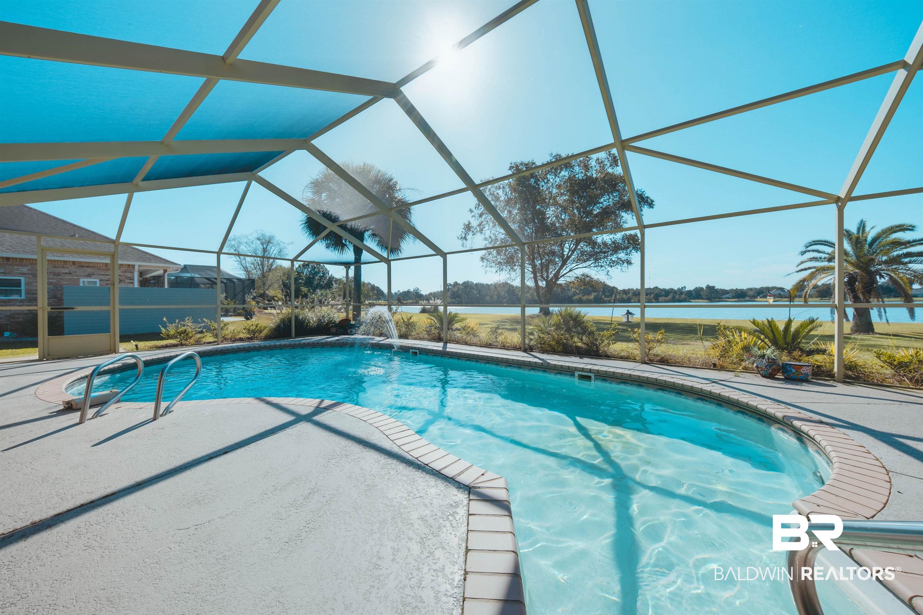 9462 Lakeview Drive Foley, AL 36535 - Photo 46 of 50 View of pool with a patio, pool water feature, a water view