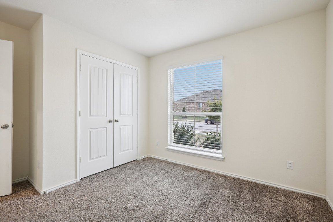 117 Break Avenue Taylor, TX 76574 - Photo 19 of 40 a view of an empty room with a window