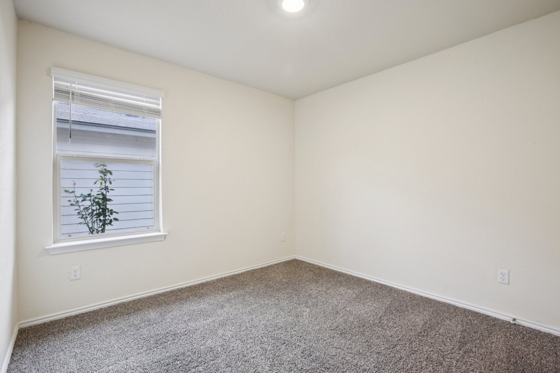 117 Break Avenue Taylor, TX 76574 - Photo 21 of 40 an empty room with a window
