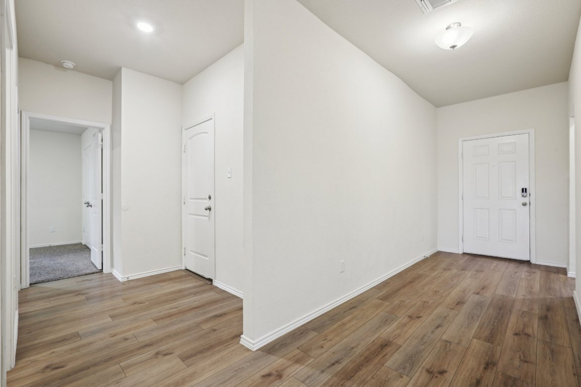 117 Break Avenue Taylor, TX 76574 - Photo 24 of 40 wooden floor in an empty room