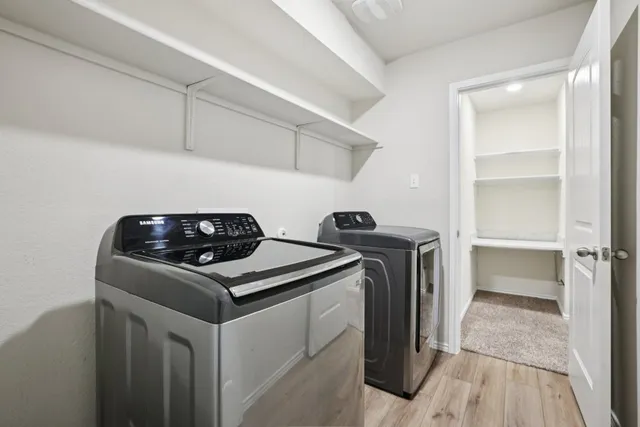 a kitchen with a stove and a refrigerator