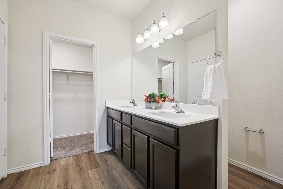 117 Break Avenue Taylor, TX 76574 - Photo 36 of 40 a bathroom with a sink and a mirror