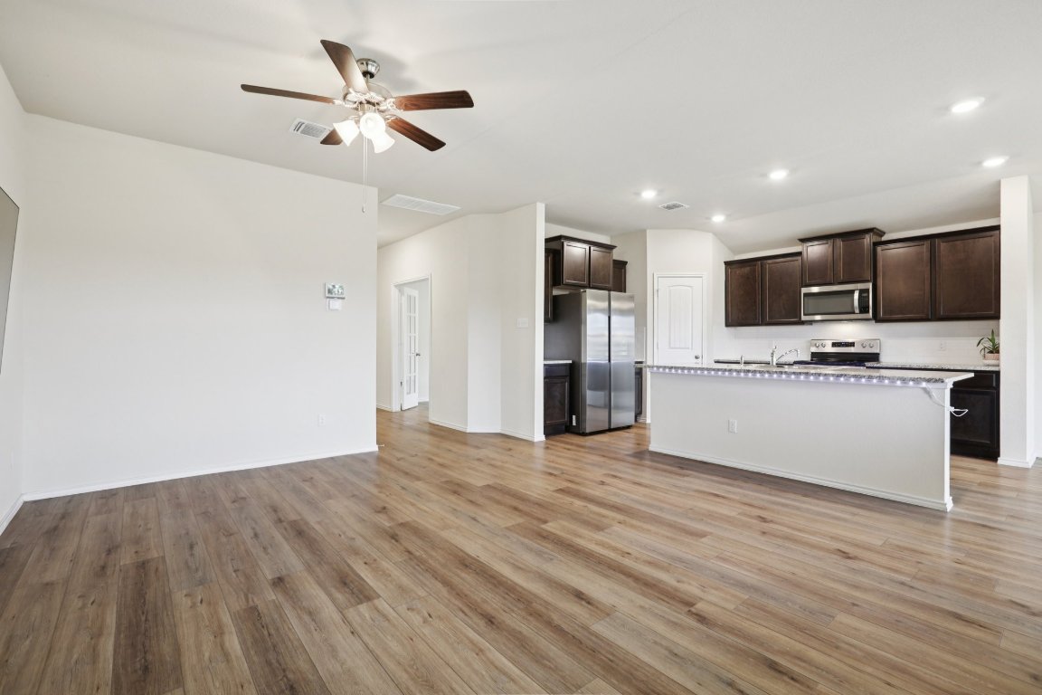 117 Break Avenue Taylor, TX 76574 - Photo 6 of 40 a view of kitchen with microwave and refrigerator