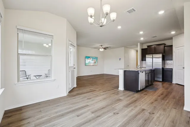 a view of a kitchen with a wooden floor