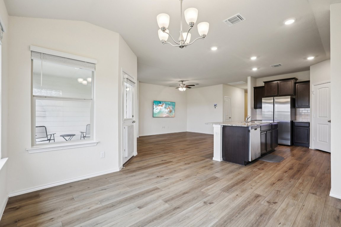 117 Break Avenue Taylor, TX 76574 - Photo 9 of 40 a view of a kitchen with a wooden floor