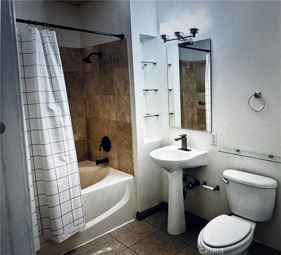 488 East Ocean Boulevard, Unit 418 Long Beach, CA 90802 - Photo 12 of 29 a bathroom with a sink toilet and shower