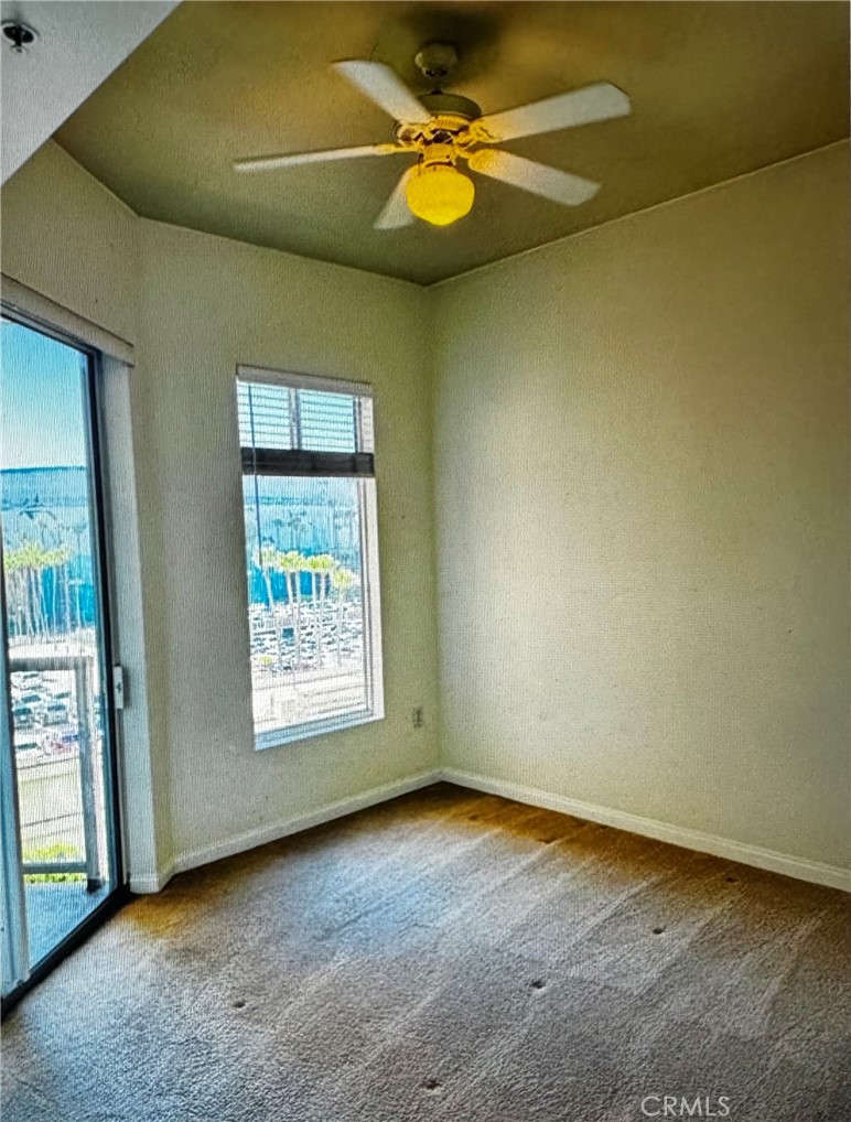 488 East Ocean Boulevard, Unit 418 Long Beach, CA 90802 - Photo 14 of 29 an empty room with windows and fan