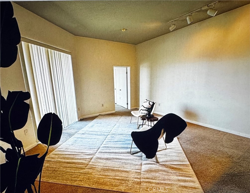 488 East Ocean Boulevard, Unit 418 Long Beach, CA 90802 - Photo 6 of 29 a bedroom with a bed and wooden floor
