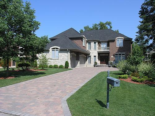 611 Greendale Road Glenview, IL 60025 - Photo 1 of 25 a front view of a house with a yard table and chairs