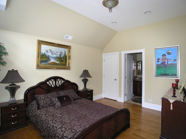 611 Greendale Road Glenview, IL 60025 - Photo 14 of 25 a bedroom with a bed a dresser and paintings on the wall