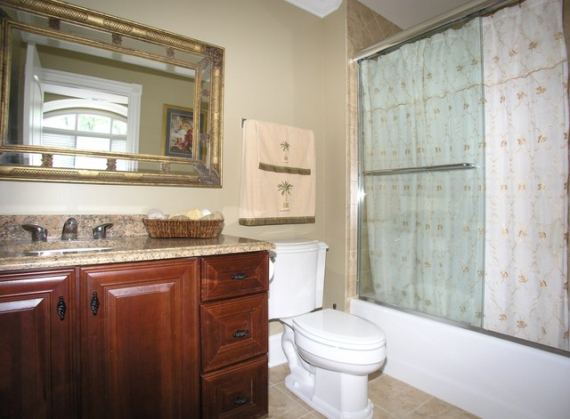 611 Greendale Road Glenview, IL 60025 - Photo 15 of 25 a bathroom with a granite countertop sink toilet and shower