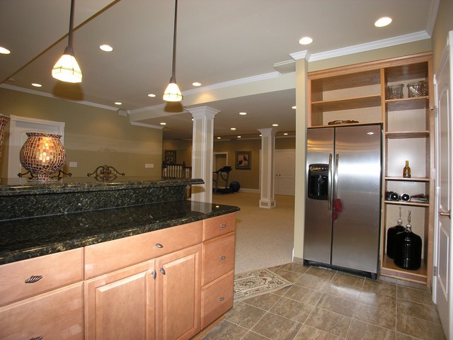 611 Greendale Road Glenview, IL 60025 - Photo 19 of 25 a large kitchen with stainless steel appliances kitchen island granite countertop a refrigerator a oven a sink and a counter top space