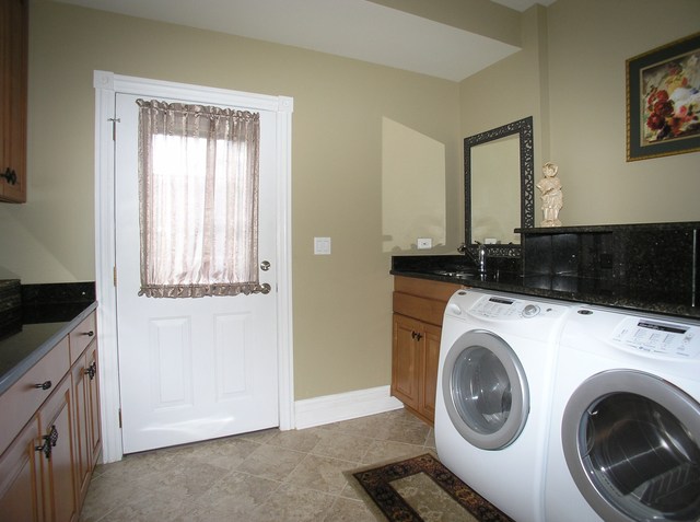 611 Greendale Road Glenview, IL 60025 - Photo 23 of 25 a view of a storage and utility room with washer and dryer