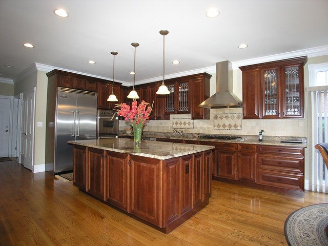611 Greendale Road Glenview, IL 60025 - Photo 3 of 25 a kitchen with stainless steel appliances granite countertop a sink a stove and a wooden floor