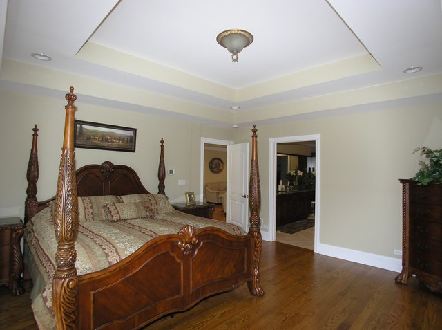 611 Greendale Road Glenview, IL 60025 - Photo 9 of 25 a bedroom with a bed and a flat tv screen on the dresser