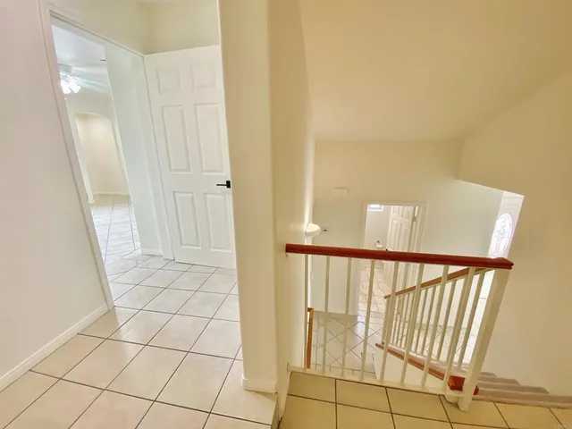 a bathroom with a granite countertop sink a mirror and a shower