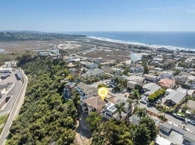 an aerial view of residential building and lake
