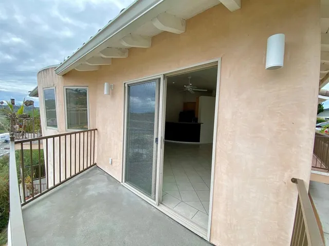 a kitchen with granite countertop a refrigerator a stove a sink a microwave and cabinets