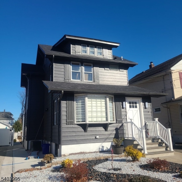 207 Post Avenue Lyndhurst, NJ 07071 - Photo 1 of 39 a front view of a house with a yard