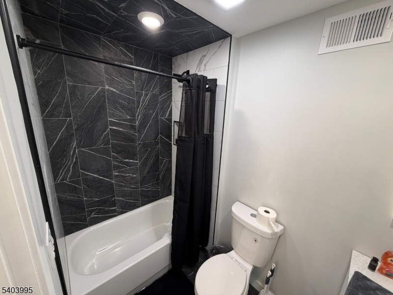 207 Post Avenue Lyndhurst, NJ 07071 - Photo 14 of 39 a bathroom with a toilet and shower