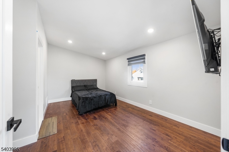 207 Post Avenue Lyndhurst, NJ 07071 - Photo 16 of 39 a living room with furniture and a wooden floor