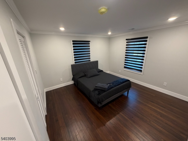 207 Post Avenue Lyndhurst, NJ 07071 - Photo 22 of 39 a living room with hard wood floors and a window