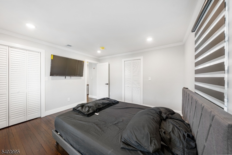 207 Post Avenue Lyndhurst, NJ 07071 - Photo 23 of 39 a bedroom with a bed and a flat screen tv