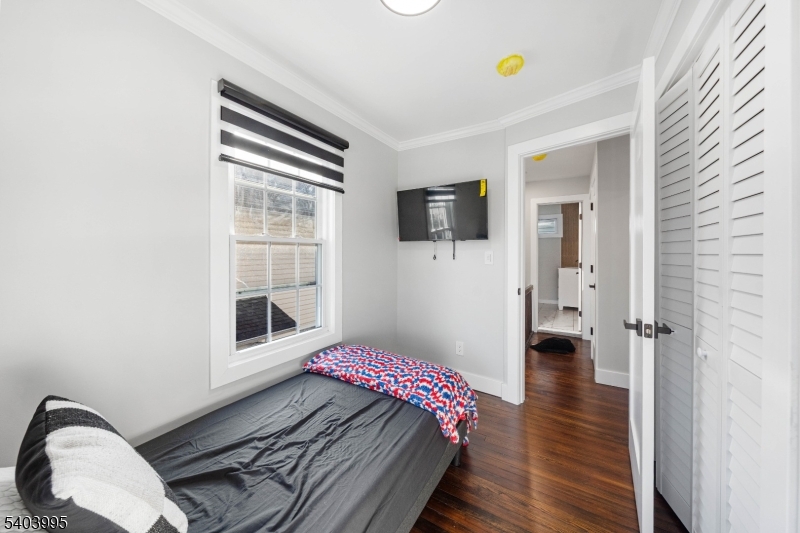 207 Post Avenue Lyndhurst, NJ 07071 - Photo 24 of 39 a bedroom with a bed and a window