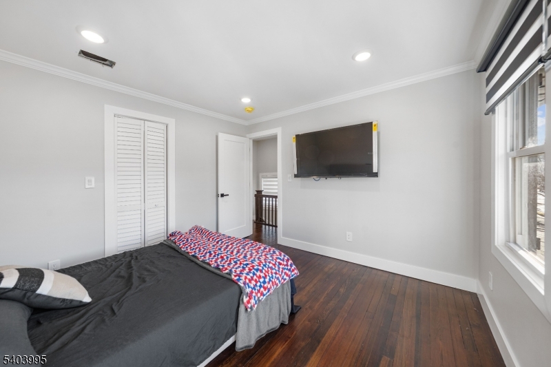 207 Post Avenue Lyndhurst, NJ 07071 - Photo 26 of 39 a bedroom with a bed and a flat screen tv