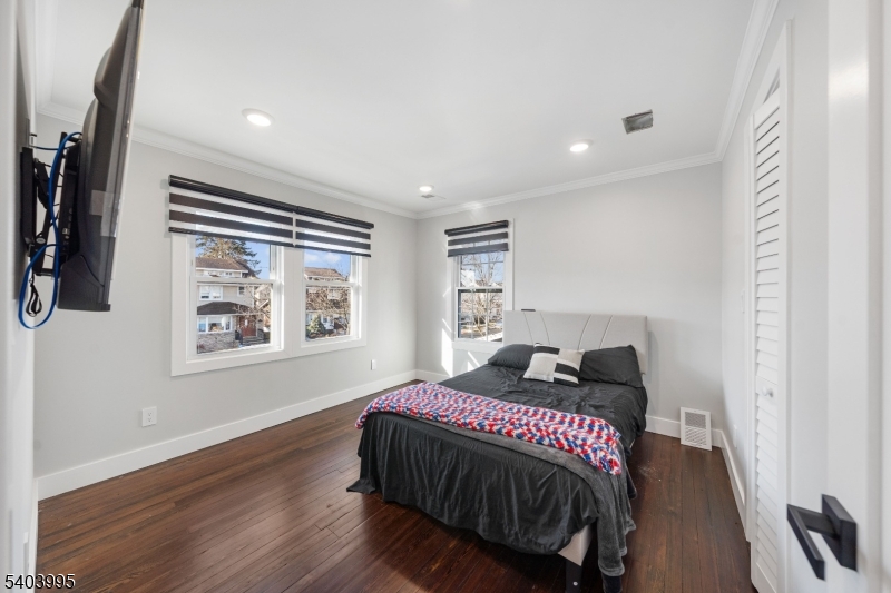 207 Post Avenue Lyndhurst, NJ 07071 - Photo 27 of 39 a bedroom with a bed and a painting on the wall