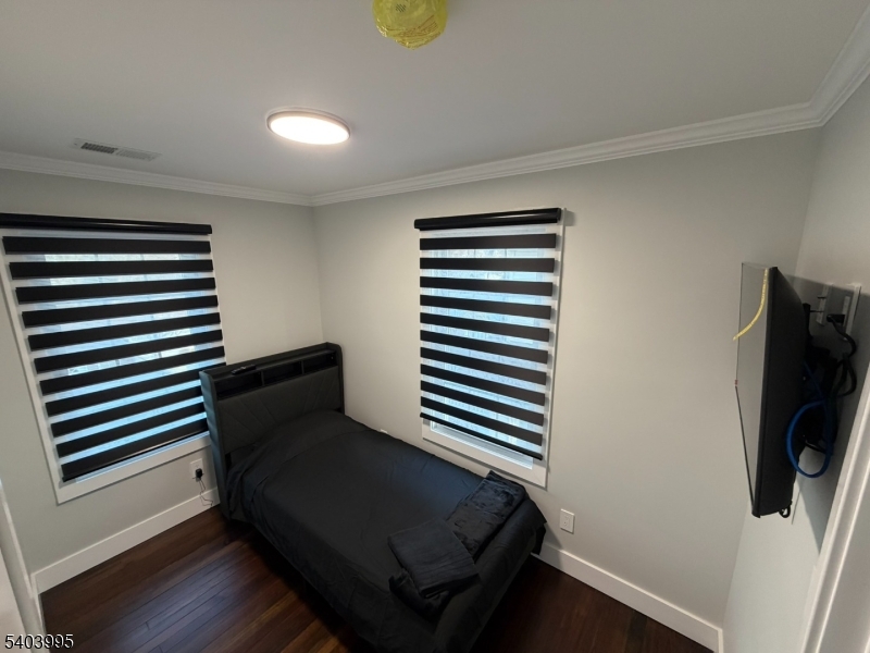 207 Post Avenue Lyndhurst, NJ 07071 - Photo 30 of 39 a view of a bedroom with furniture and wooden floor