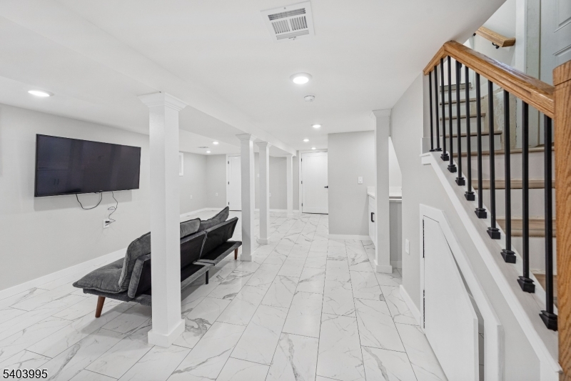 207 Post Avenue Lyndhurst, NJ 07071 - Photo 32 of 39 a living room with furniture and a flat screen tv