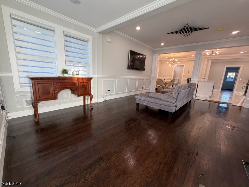 207 Post Avenue Lyndhurst, NJ 07071 - Photo 5 of 39 a living room with furniture and a wooden floor