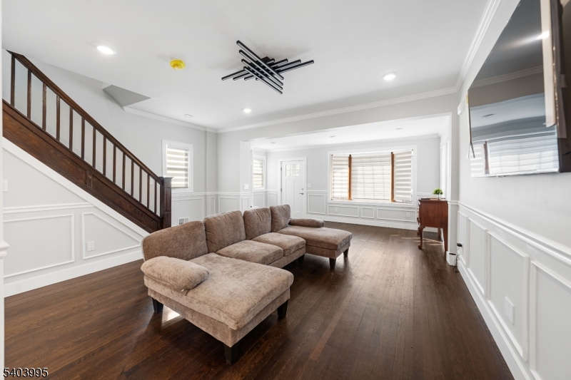 207 Post Avenue Lyndhurst, NJ 07071 - Photo 7 of 39 a living room with furniture and a wooden floor