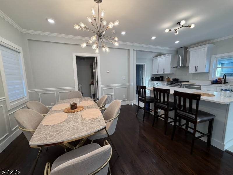 207 Post Avenue Lyndhurst, NJ 07071 - Photo 9 of 39 a dining room with furniture a chandelier and wooden floor