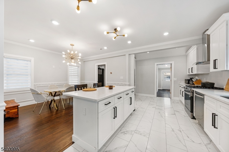 207 Post Avenue Lyndhurst, NJ 07071 - Photo 10 of 39 a kitchen with a stove a sink a dining table and chairs