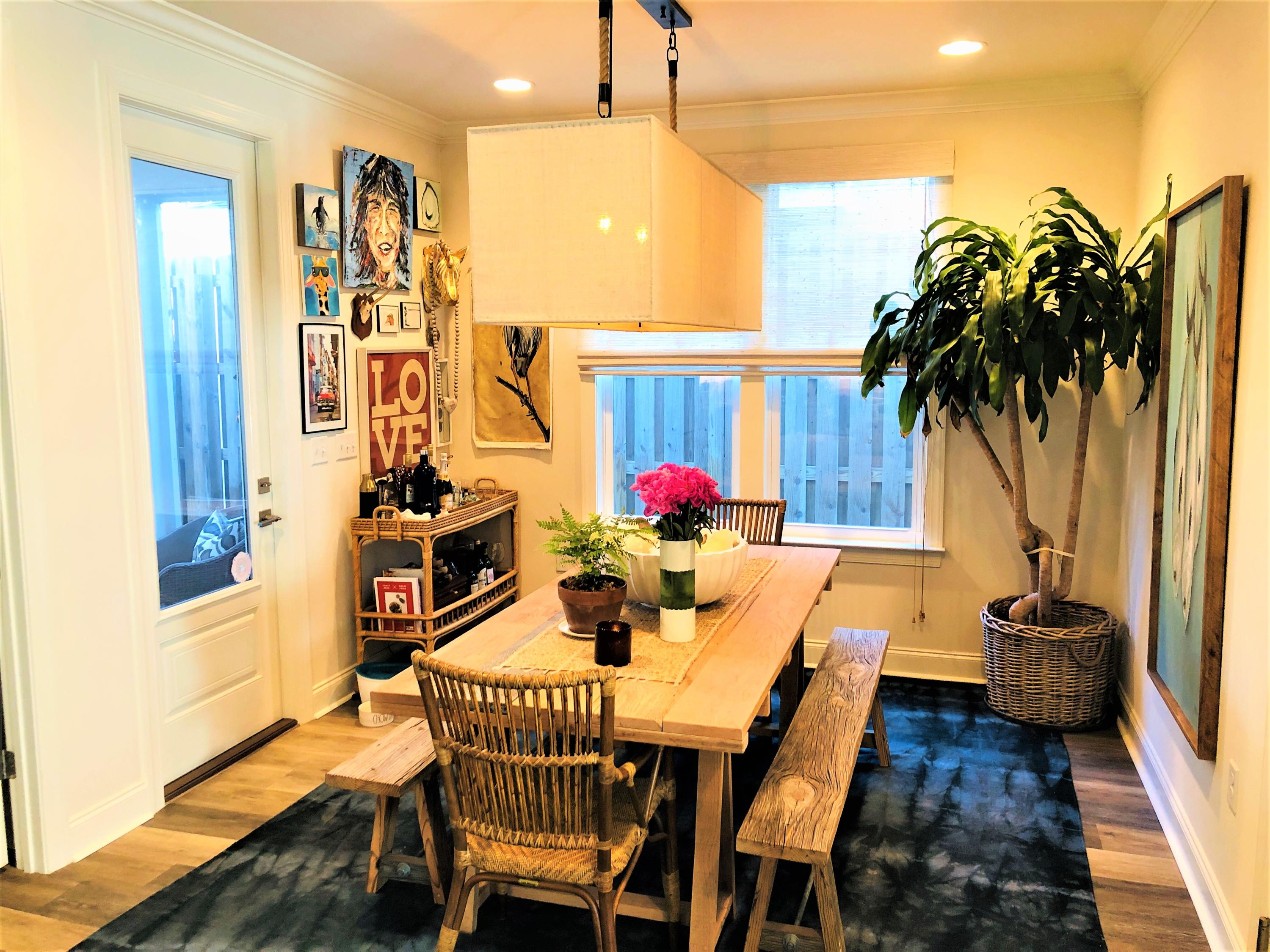 195 Chapman Street Santa Rosa Beach, FL 32459 - Photo 7 of 25 a view of a dining room with furniture and wooden floor