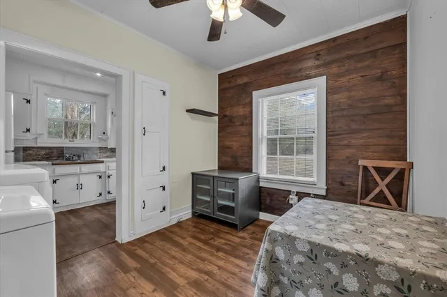 a bedroom with a bed and a dresser