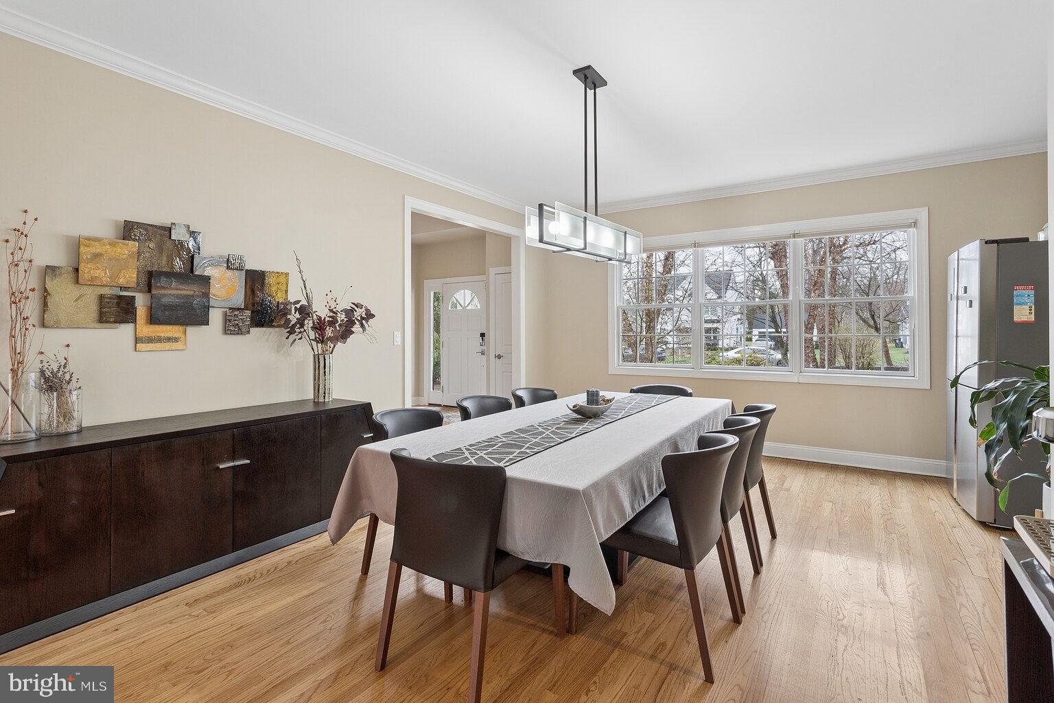 29 Dempsey Avenue Princeton, NJ 08540 - Photo 11 of 58 a view of a dining room and livingroom with furniture wooden floor a chandelier