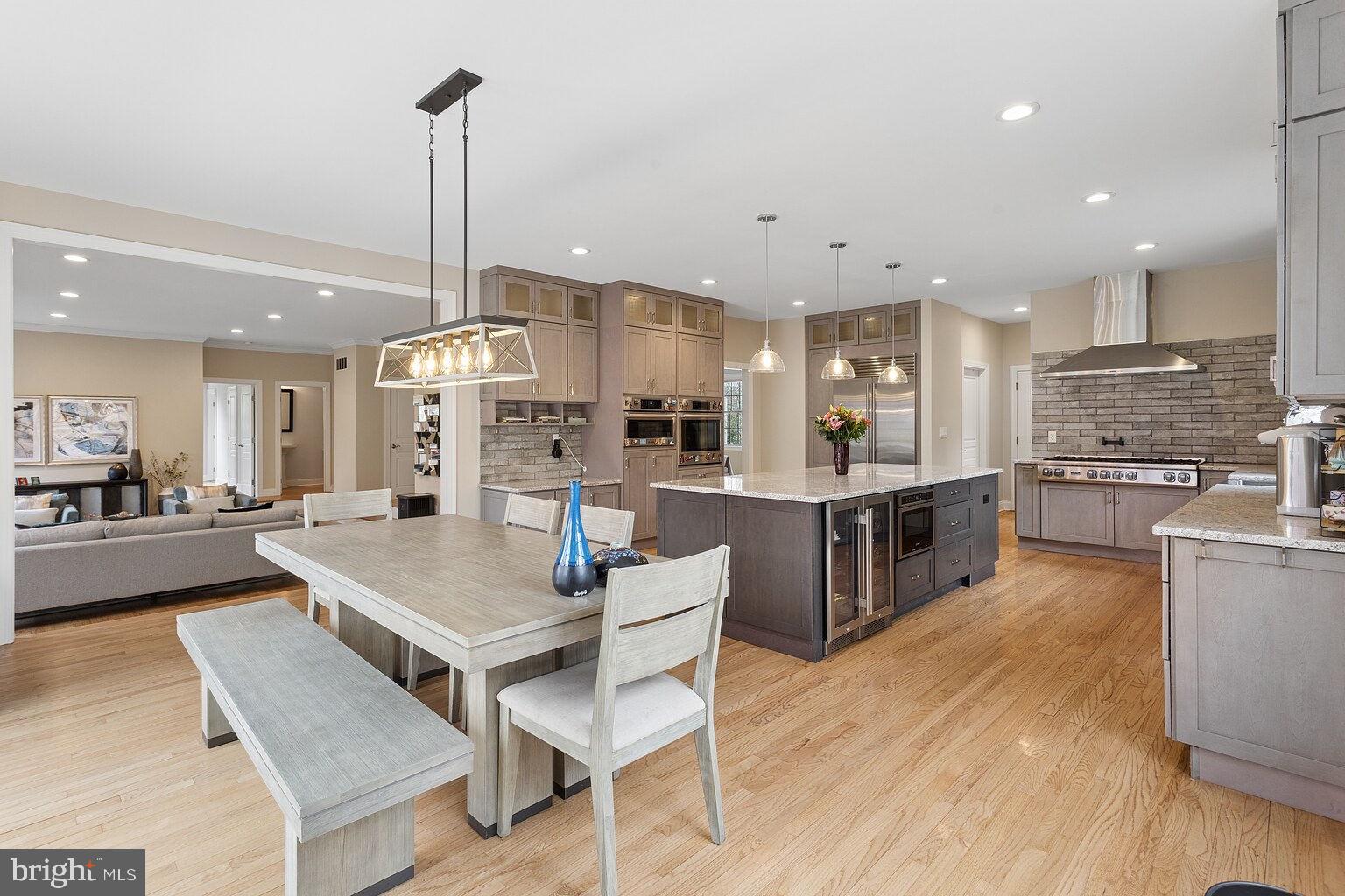 29 Dempsey Avenue Princeton, NJ 08540 - Photo 13 of 58 a kitchen with stainless steel appliances kitchen island granite countertop a table chairs a sink and a counter top space