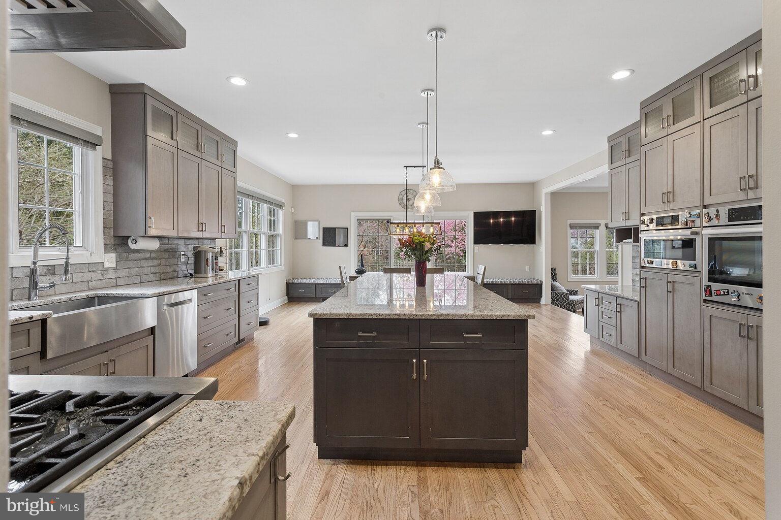 29 Dempsey Avenue Princeton, NJ 08540 - Photo 15 of 58 a kitchen with stainless steel appliances granite countertop a stove a sink dishwasher a refrigerator and a oven with wooden floor