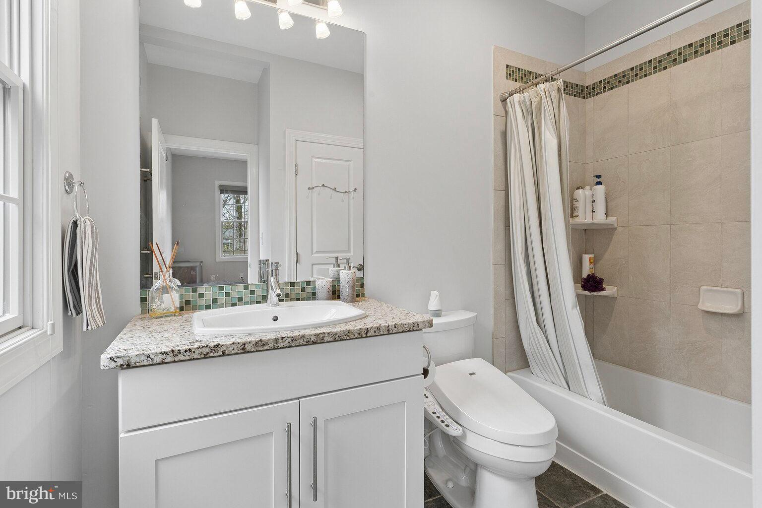 29 Dempsey Avenue Princeton, NJ 08540 - Photo 26 of 58 a bathroom with a granite countertop sink toilet and shower