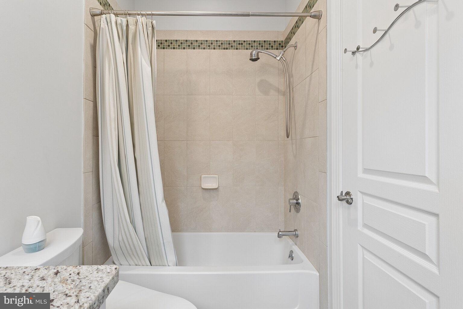 29 Dempsey Avenue Princeton, NJ 08540 - Photo 27 of 58 a bathroom with a bathtub a sink and a shower